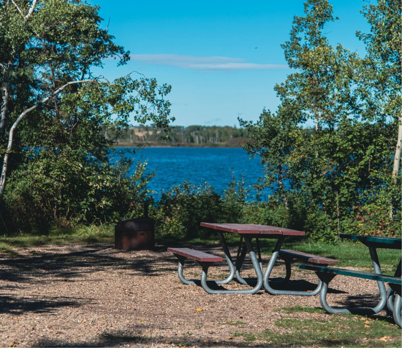 a picnic table overlooking a lake