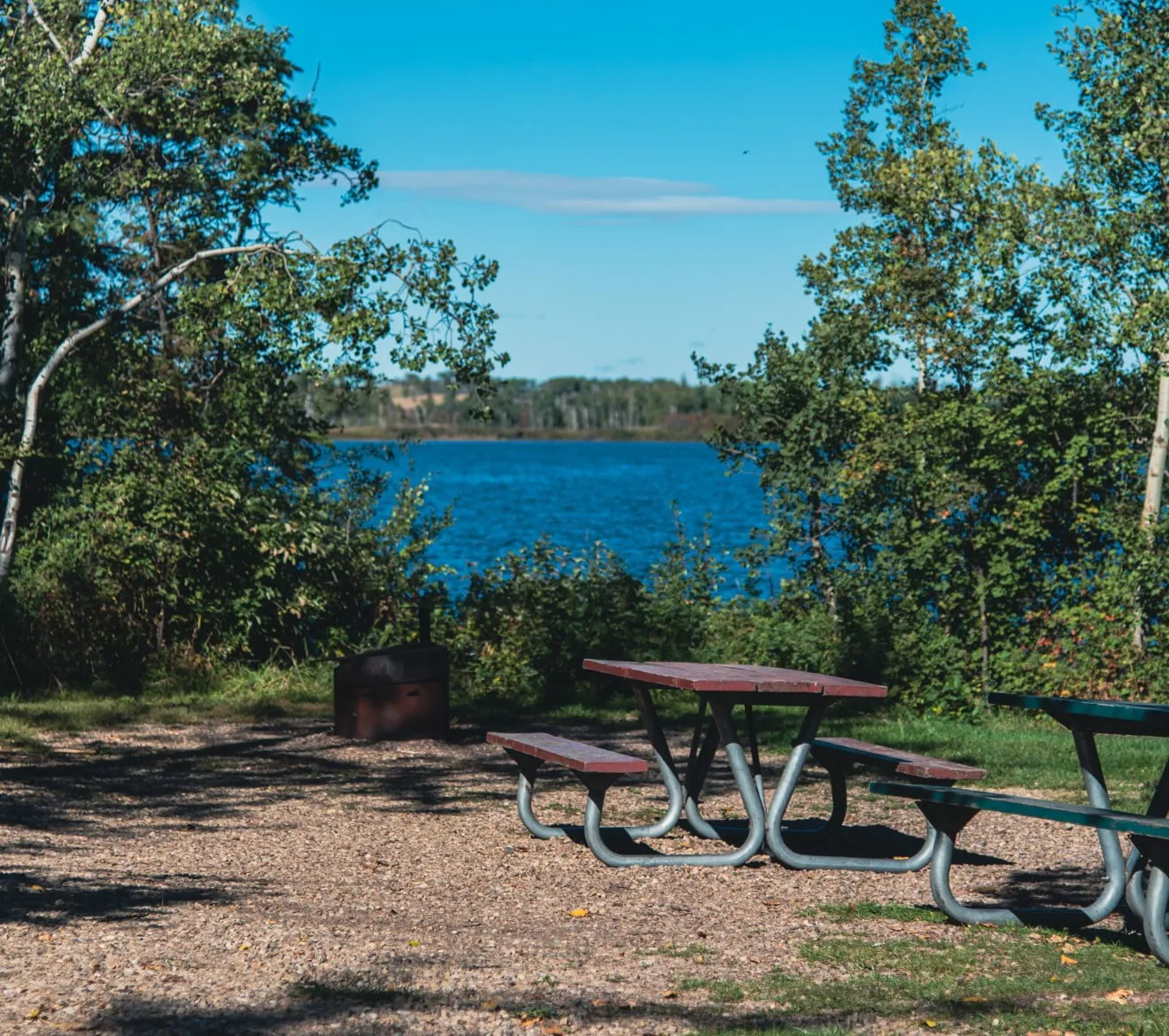 a picnic table overlooking a lake